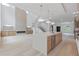 Bright, open-concept kitchen features a large island, stainless steel appliances, and modern lighting at 1349 Oak Road, Lilburn, GA 30047