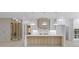 Modern kitchen featuring a large island with a quartz countertop and modern appliances at 1349 Oak Road, Lilburn, GA 30047