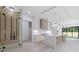 Modern kitchen featuring an island with quartz countertop and wine storage at 1349 Oak Road, Lilburn, GA 30047