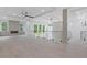 Spacious living room featuring hardwood flooring, fireplace, modern lighting, and large windows at 1349 Oak Road, Lilburn, GA 30047