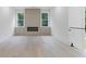 Bright living room featuring hardwood flooring, fireplace, modern lighting, and large windows at 1349 Oak Road, Lilburn, GA 30047
