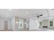 Bright and airy main bedroom with a modern ceiling fan, fireplace, and framed mirror at 1349 Oak Road, Lilburn, GA 30047