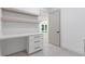 Modern office featuring floating shelves and a built-in desk with three drawers at 1349 Oak Road, Lilburn, GA 30047