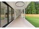The large covered patio offers an outdoor dining area and additional space to relax at 1349 Oak Road, Lilburn, GA 30047