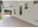 A covered back patio featuring concrete pavers and a ceiling fan at 1349 Oak Road, Lilburn, GA 30047