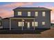 Exterior view of the home showcasing the backyard, patio and lawn at 1462 Stephens View Dr, Loganville, GA 30052