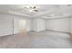 An expansive bedroom with neutral carpet, recessed lights, ceiling fan, and tray ceiling at 1462 Stephens View Dr, Loganville, GA 30052