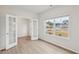 Cozy room featuring white doors and a window overlooking the lawn and a home across the street at 1462 Stephens View Dr, Loganville, GA 30052