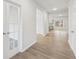 Inviting foyer with wood-look flooring, french doors and an open view to the main living area and kitchen at 1462 Stephens View Dr, Loganville, GA 30052