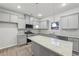 Stylish kitchen featuring stainless steel appliances, granite countertops, and gray cabinets at 1462 Stephens View Dr, Loganville, GA 30052