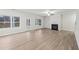 Spacious living room featuring fireplace, ceiling fan, and wood-look flooring for comfortable living at 1462 Stephens View Dr, Loganville, GA 30052