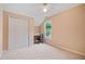Cozy bedroom with an office nook, large closet, and window letting in plenty of natural light at 523 Huntgate Rd, Woodstock, GA 30189