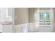 Bright dining room featuring large windows, natural light and detailed wall trim at 523 Huntgate Rd, Woodstock, GA 30189