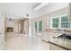 Bright kitchen with tiled floor, French doors to yard, gas range, white cabinets and plenty of light at 523 Huntgate Rd, Woodstock, GA 30189