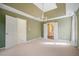 Large main bedroom features neutral decor, crown molding, ceiling fan and ensuite bath at 523 Huntgate Rd, Woodstock, GA 30189