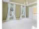 Large, comfortable main bedroom boasts ceiling fan, crown molding and lots of natural light at 523 Huntgate Rd, Woodstock, GA 30189