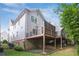 Backyard featuring a two-story deck and partial brick facade at 5981 Brundage Ln, Norcross, GA 30071