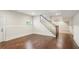 A finished basement with hardwood floors, carpet, and a staircase at 5981 Brundage Ln, Norcross, GA 30071