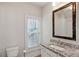 Neat bathroom with granite sink and modern fixtures at 5981 Brundage Ln, Norcross, GA 30071