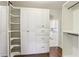 Walk-in closet featuring custom shelving and ample storage space at 5981 Brundage Ln, Norcross, GA 30071