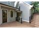 A wooden deck shows steps and a door to the basement at 5981 Brundage Ln, Norcross, GA 30071