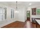 Dining area features hardwood floors, plantation shutters, and views to the outside at 5981 Brundage Ln, Norcross, GA 30071