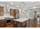 Open concept kitchen with stainless steel appliances and large center island at 5981 Brundage Ln, Norcross, GA 30071