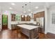 Modern kitchen with stainless appliances, center island, and custom cabinets at 5981 Brundage Ln, Norcross, GA 30071