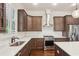 Beautiful kitchen with stainless steel appliances, subway tile backsplash and wooden cabinets at 5981 Brundage Ln, Norcross, GA 30071
