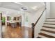 Bright, open living space with hardwood floors, white trim, stainless steel appliances, and a modern kitchen island at 5981 Brundage Ln, Norcross, GA 30071
