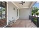 Cozy front porch featuring wooden floors and a charming seating area, ideal for relaxing and enjoying the outdoors at 5981 Brundage Ln, Norcross, GA 30071
