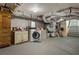 Utility area in basement featuring washer, dryer, and storage space, offering practicality and functionality at 1053 Crane Ne Rd, Atlanta, GA 30324