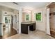 Bright bathroom featuring a shower, makeup vanity, and access to main bedroom at 1053 Crane Ne Rd, Atlanta, GA 30324