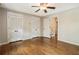 Bright bedroom with beautiful hardwood floors, ceiling fan, and closet space, perfect for a peaceful retreat at 1053 Crane Ne Rd, Atlanta, GA 30324