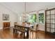 Dining room featuring hardwood floors, chandelier, and natural light at 1053 Crane Ne Rd, Atlanta, GA 30324