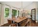 Dining room with hardwood floors, chandelier and large windows for natural light at 1053 Crane Ne Rd, Atlanta, GA 30324