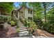 Inviting front entrance with stone steps and decorative landscaping at 1053 Crane Ne Rd, Atlanta, GA 30324