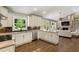 Open kitchen and living room area, perfect for entertaining with stainless appliances and stone countertops at 1053 Crane Ne Rd, Atlanta, GA 30324