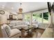 Inviting living room flows into a gourmet kitchen with high ceilings and natural light at 1053 Crane Ne Rd, Atlanta, GA 30324
