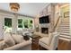 Bright living room showcasing a fireplace, hardwood floors and natural lighting at 1053 Crane Ne Rd, Atlanta, GA 30324