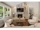 Cozy living room featuring a fireplace, hardwood floors and natural lighting at 1053 Crane Ne Rd, Atlanta, GA 30324