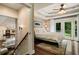Comfortable main bedroom showcasing a tray ceiling and private outdoor access with natural light at 1053 Crane Ne Rd, Atlanta, GA 30324