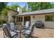 Brick patio with table, chairs, and grill, surrounded by lush greenery at 1053 Crane Ne Rd, Atlanta, GA 30324