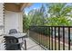 Private balcony with chairs and table overlooking lush greenery and parking at 1850 Cotillion Dr # 3215, Atlanta, GA 30338