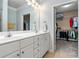Bathroom features a double vanity, and entrance to a walk in closet with lots of storage space at 1850 Cotillion Dr # 3215, Atlanta, GA 30338