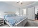 Bright bedroom features neutral paint, carpet, and multiple doors, including one to the bathroom at 1850 Cotillion Dr # 3215, Atlanta, GA 30338