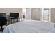 Bedroom with TV, bed, and doors that lead to the hallway and the bathroom at 1850 Cotillion Dr # 3215, Atlanta, GA 30338