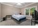 Bedroom with a bed, desk, and window letting in natural light at 1850 Cotillion Dr # 3215, Atlanta, GA 30338