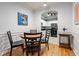 Cozy dining area with decorative painting and modern lighting adjoins the kitchen at 1850 Cotillion Dr # 3215, Atlanta, GA 30338