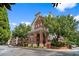 Striking brick building with arched entryways and mature landscaping offers a luxurious living experience at 1850 Cotillion Dr # 3215, Atlanta, GA 30338